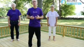 Three people about to do yoga pose